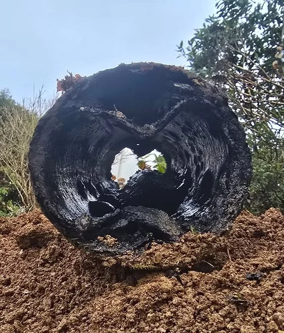 Severely deteriorated drain pipe cross-section before repair